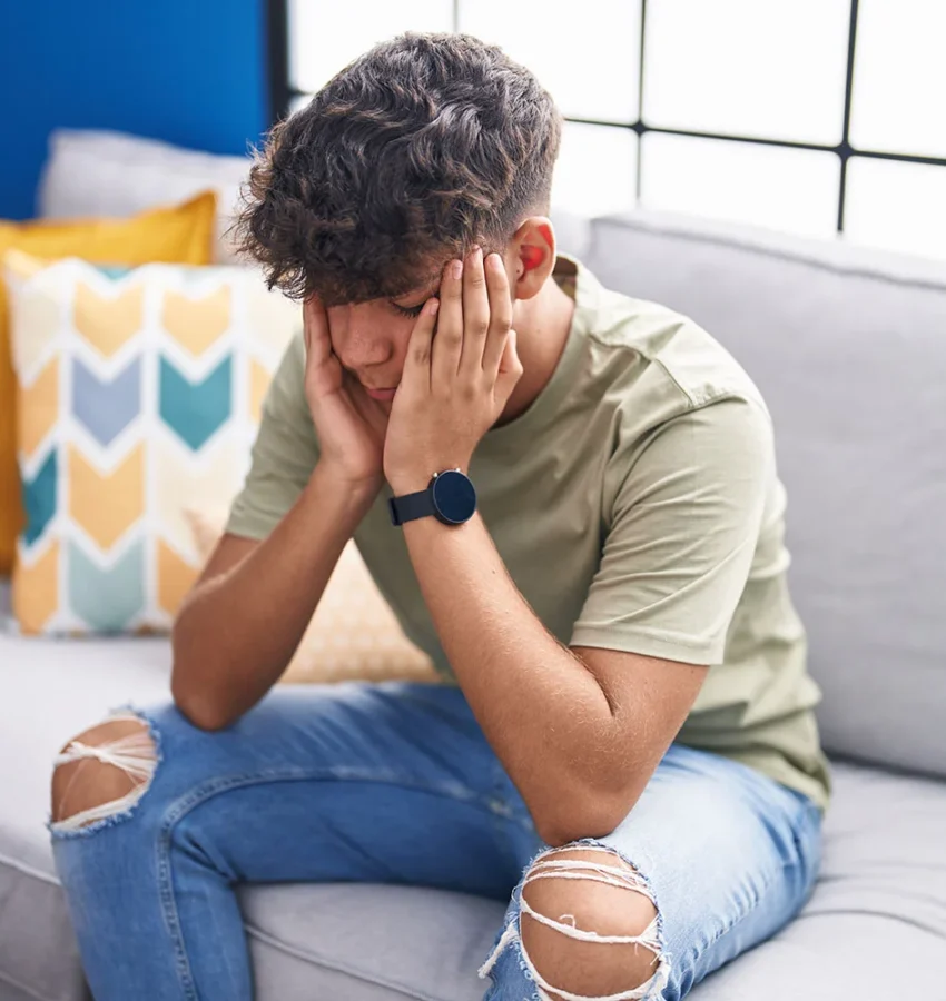 stressed teenager sitting at home