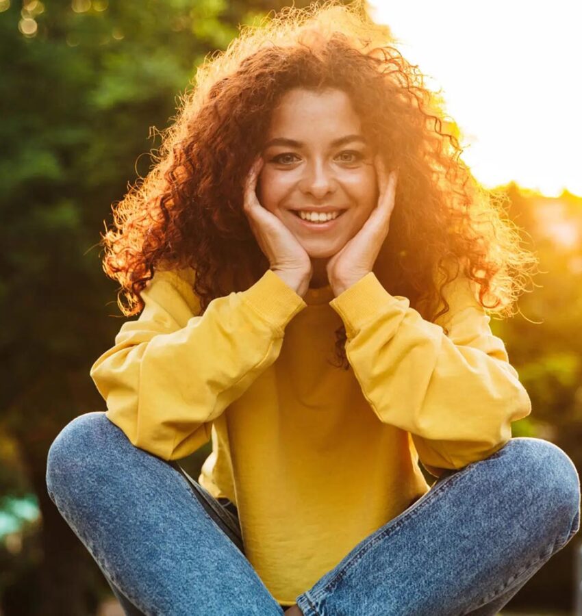 Smiling woman outside at heroin addiction treatment in Los Angeles